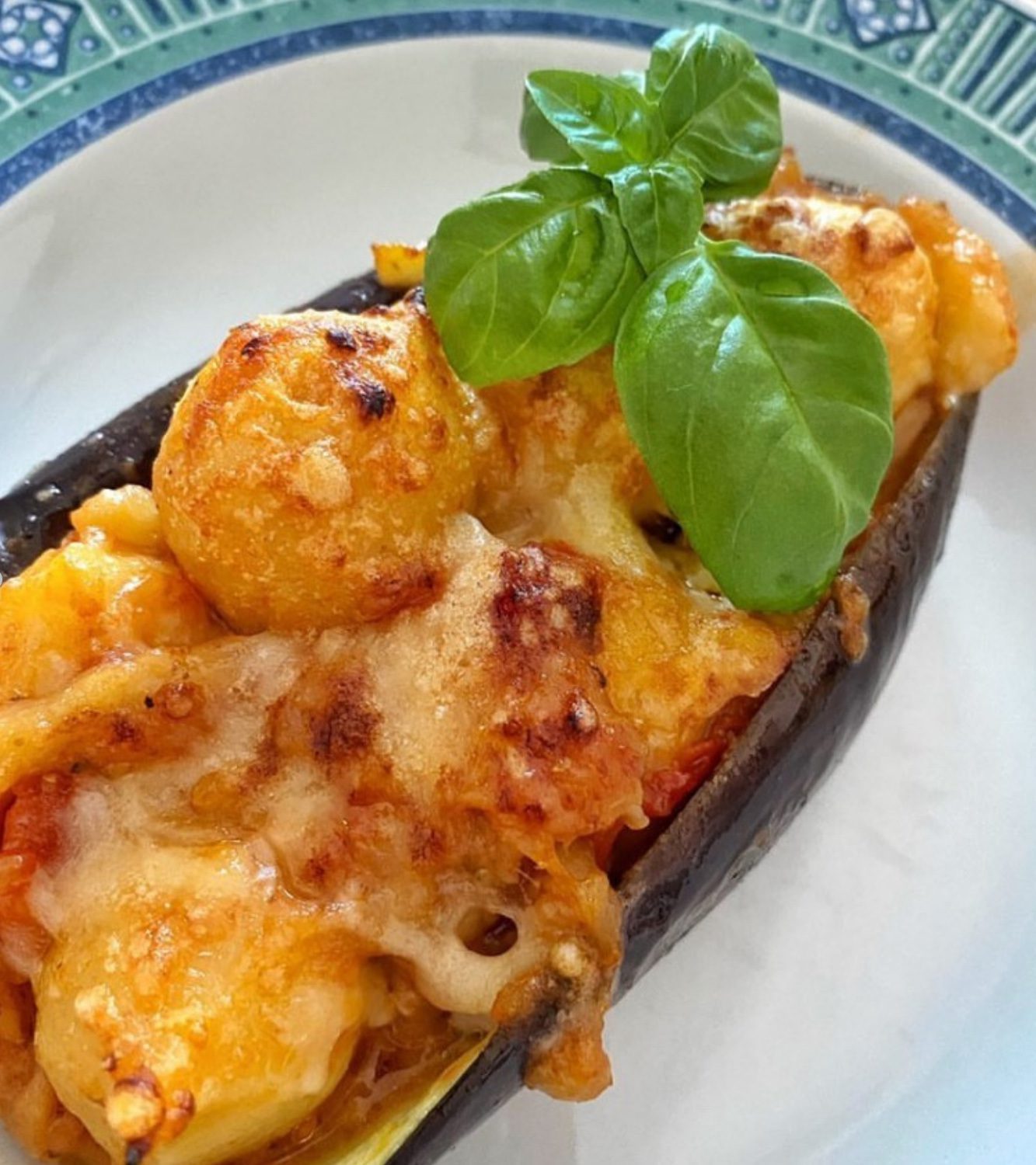 Gnocchi stuffed with tomato and mozzarella eggplant boats